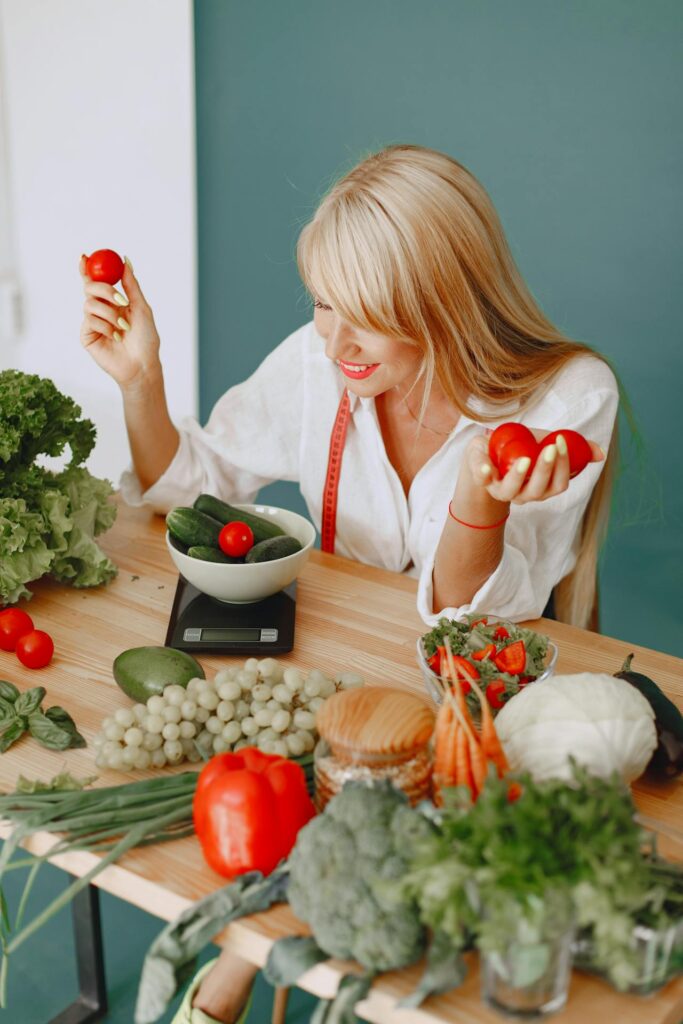 image of a woman weighing tomatoes